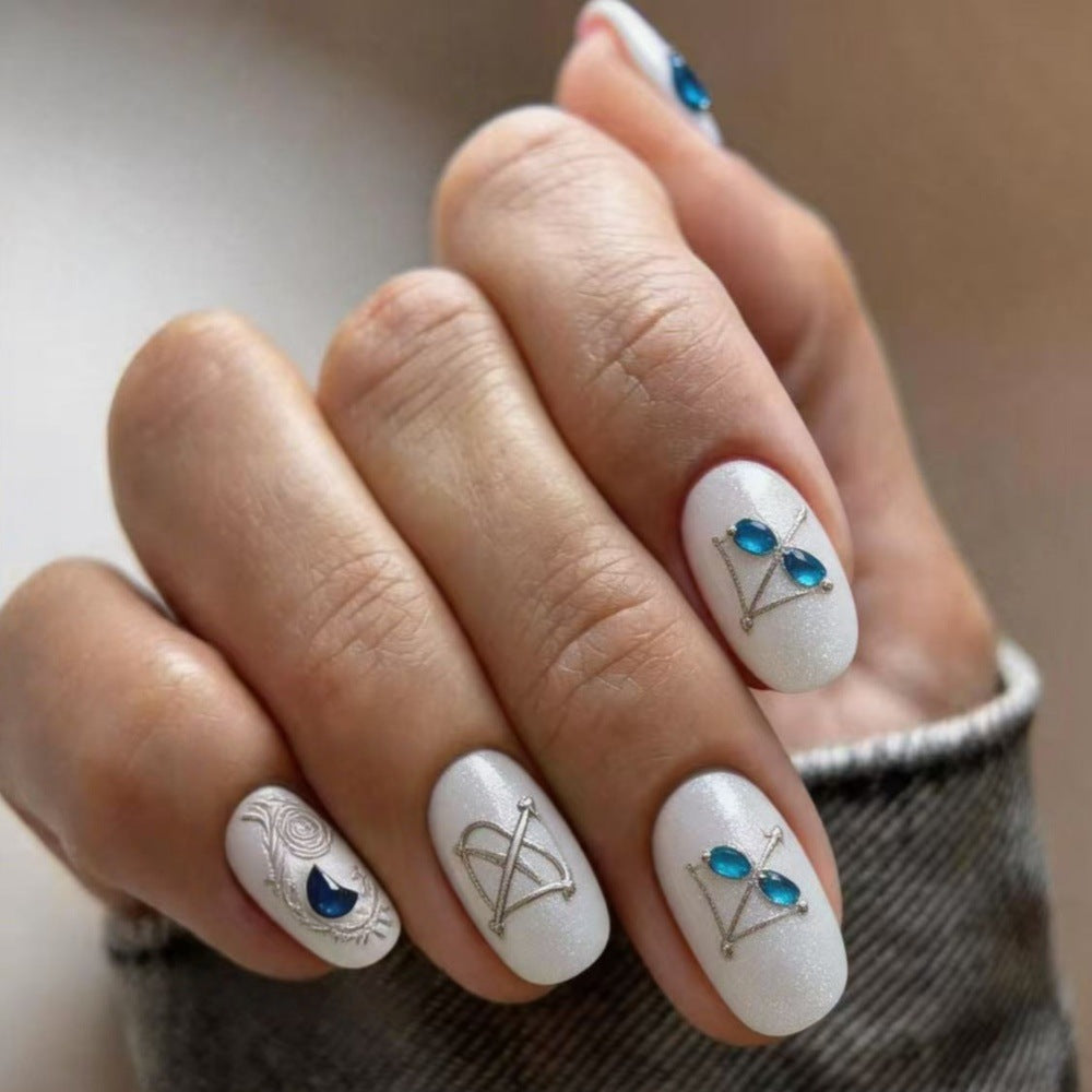 Artificial nails with elegant jewelry embellishments Bowlift