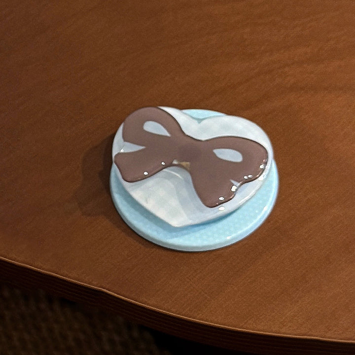 Decorative ceramic coaster with bow motif Bowlift