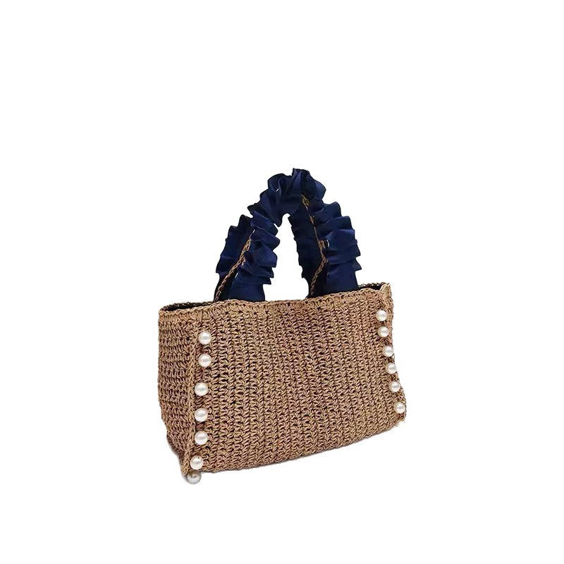 Fashionable straw bag with ruffle detail Bowlift