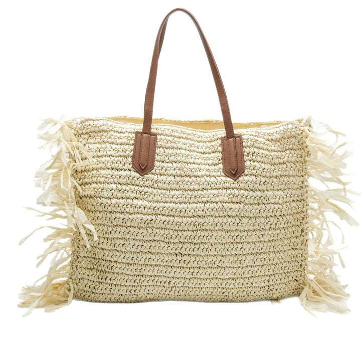Beach bag made of handwoven straw with fringes Bowlift