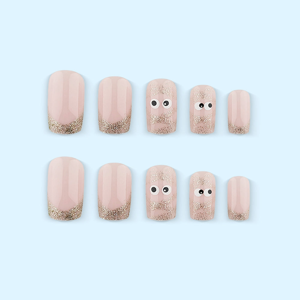 Artificials nails with playful eye design and glitter tips Bowlift
