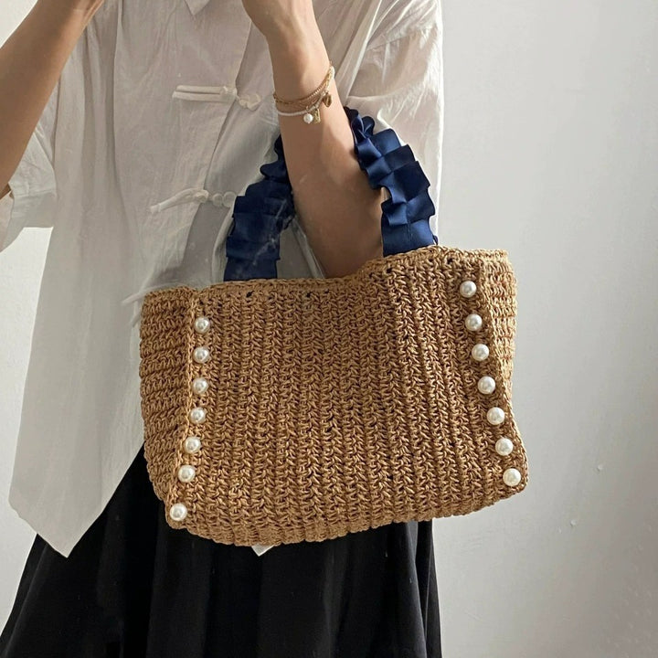 Fashionable straw bag with ruffle detail Bowlift
