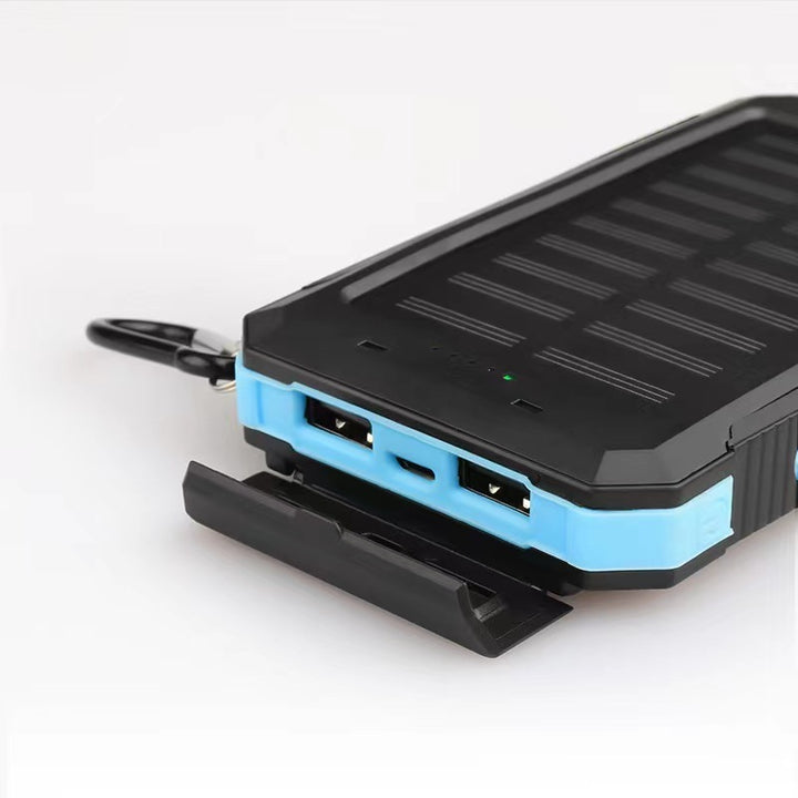 Solar-powered power bank with impact-resistant design and integrated carabiner Bowlift