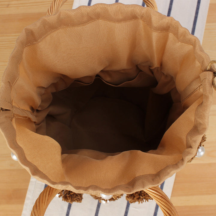 Handcrafted basket bag with bead appliqués Bowlift