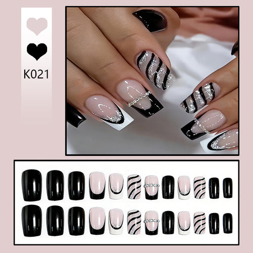 Elegant artificial nails with glitter and stripe accents Bowlift