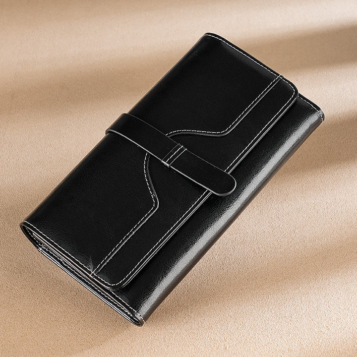 Premium leather long wallet clutch with strap closure and multiple card slots Bowlift