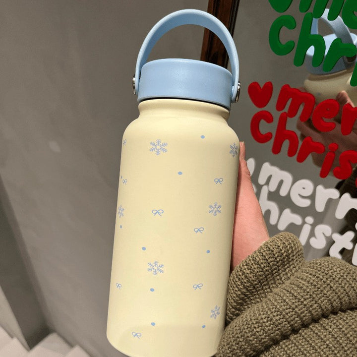 Women's insulated drinking bottle with practical carrying handle and cheerful design Bowlift