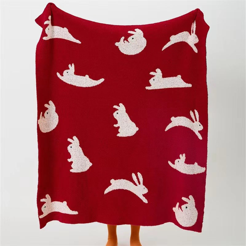 Jacquard knit cuddle blanket with rabbit motifs Bowlift