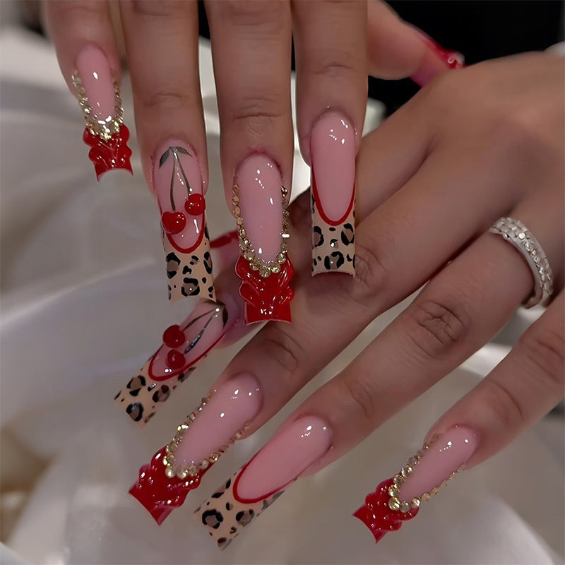 Artistic Long Press-On Nail Extensions with Decorative Accents Bowlift