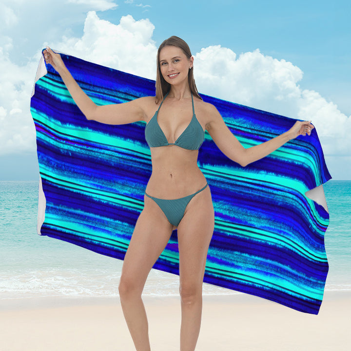 Beach towel with vibrant tropical plant motif Bowlift