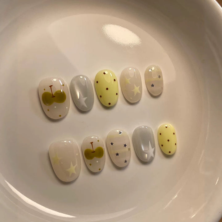 Artistic Press-On Nail Set with Whimsical Patterns