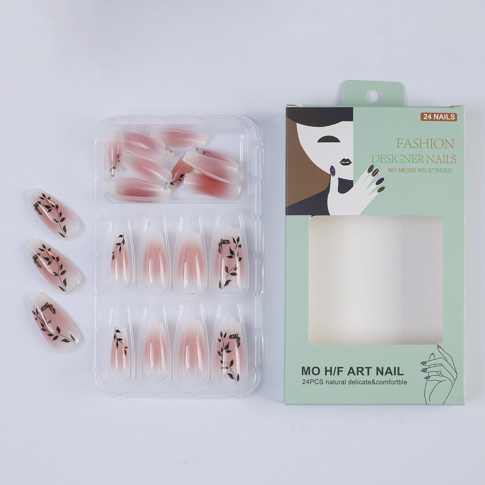 Press-on nails in elegant ombre design with floral accents Bowlift