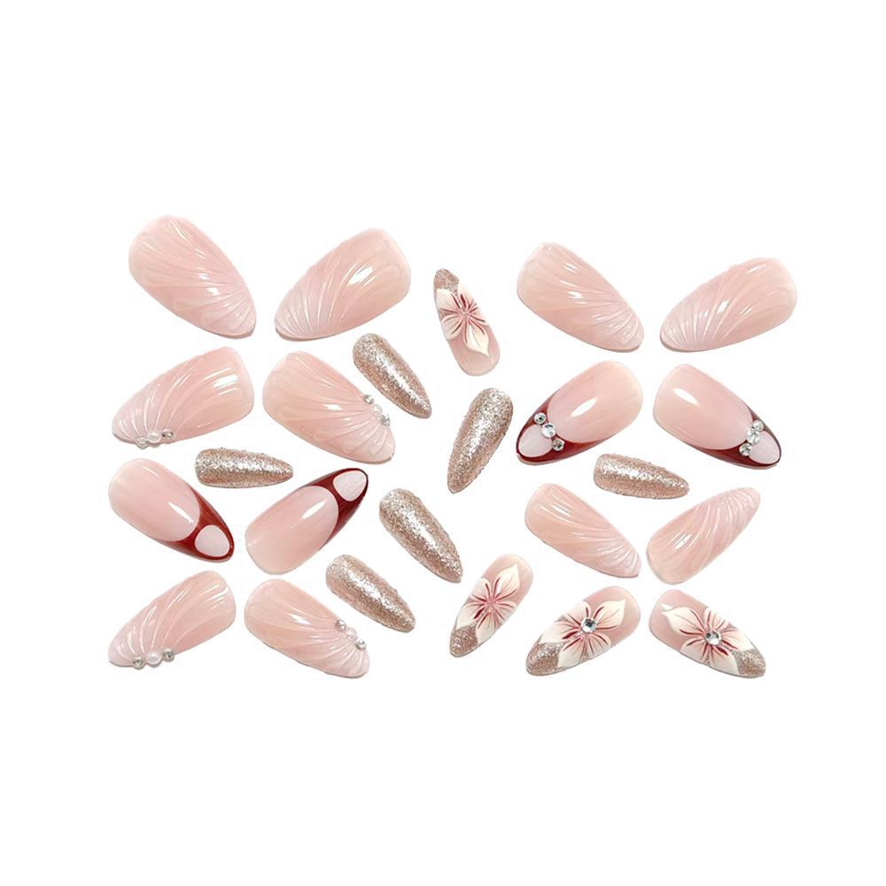 Artificial nails in elegant floral design with glitter accents Bowlift