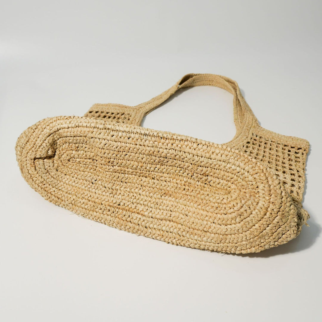 Hand-knotted raffia bag with generous interior Bowlift