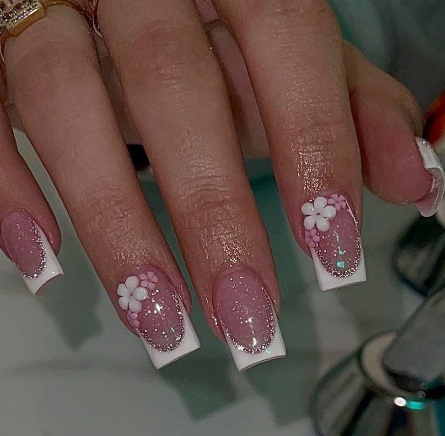 Acrylic nail set with elegant French tip and delicate floral decorations Bowlift