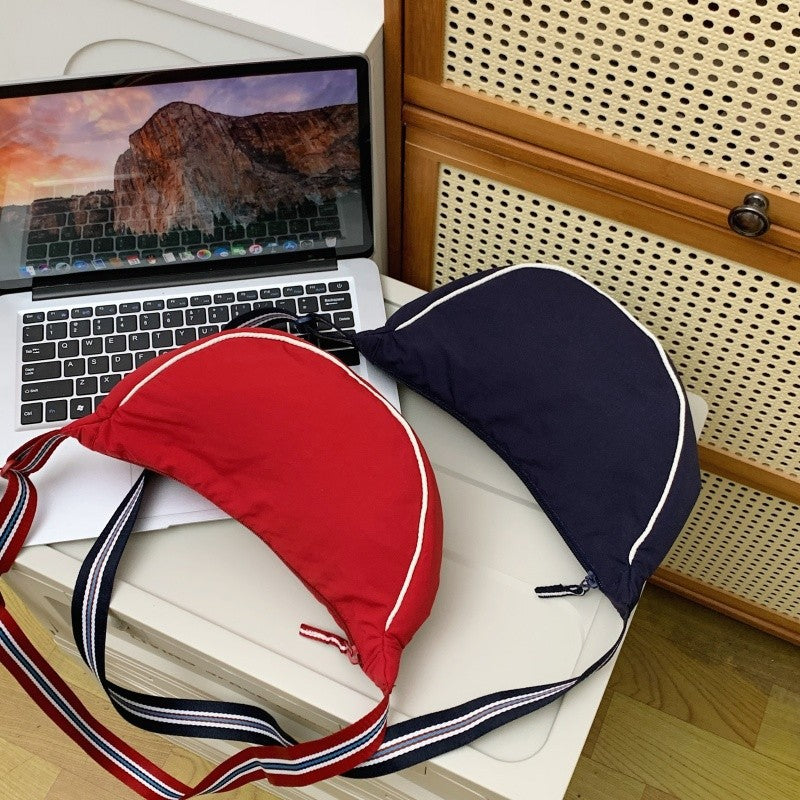 Fashionable shoulder bag with unique cut and adjustable strap Bowlift