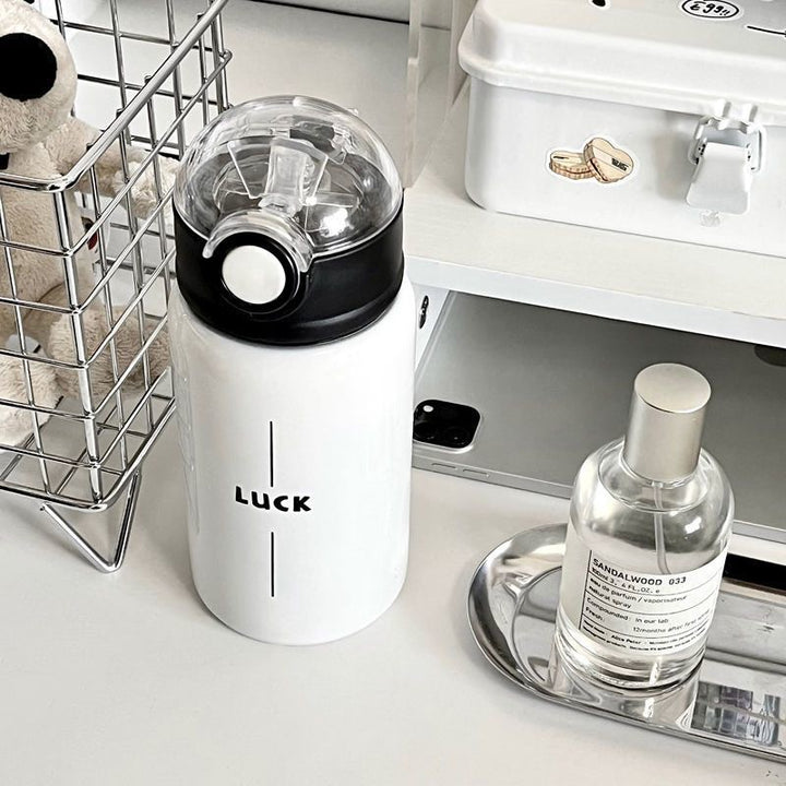 Women's insulated drinking bottle with innovative flip lid and practical handle Bowlift