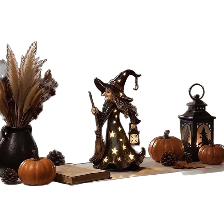 Decorative witch figure with broom Bowlift