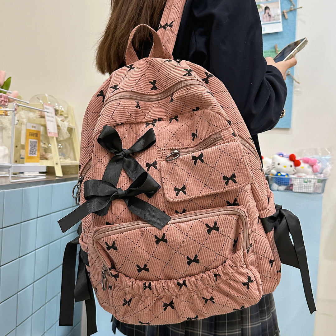 Playful backpack with bow details and practical compartments Bowlift