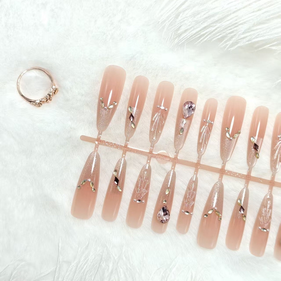 Artificial nails with glamorous crystal embellishments Bowlift