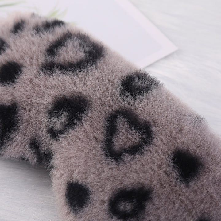 Women's cuddly faux fur sleep mask with heart-embossed surface and gathered comfort band Bowlift