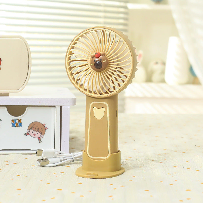 Unisex portable rechargeable battery hand fan with USB charging station and child-safe bear design Bowlift