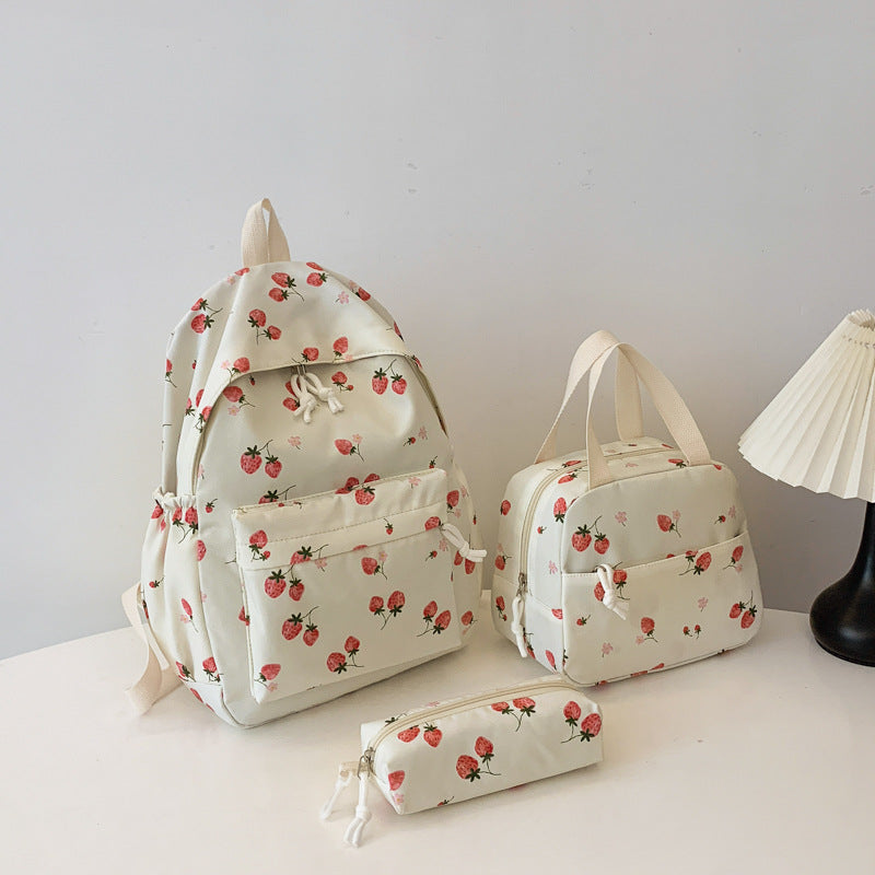 Backpack set with cheerful strawberry pattern and practical compartments Bowlift