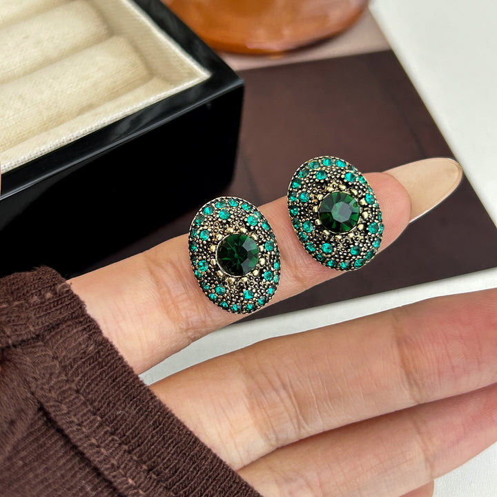Sparkling stud earrings with intricate details Bowlift