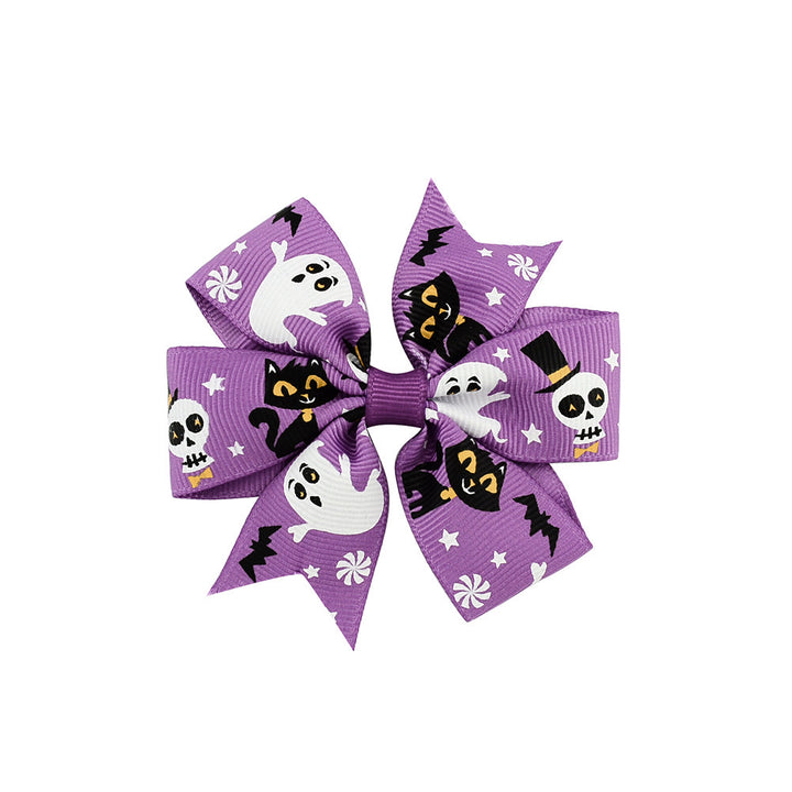 Halloween bow with pumpkin and witch motifs