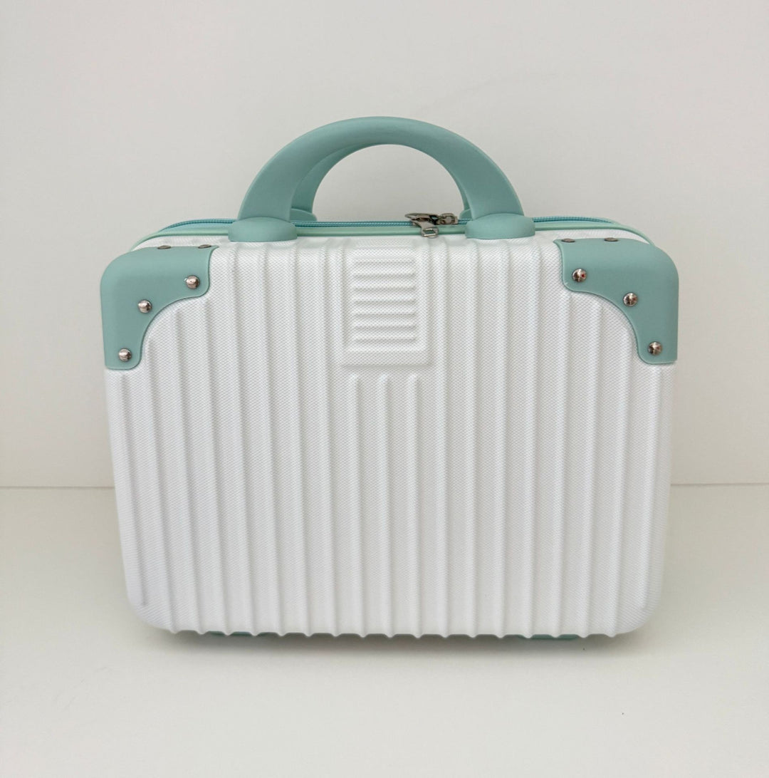 compact hard-shell travel vanity cosmetic and tech organizer with ribbed shell reinforced corners removable padded insert Bowlift