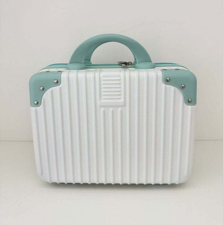 compact hard-shell travel vanity cosmetic and tech organizer with ribbed shell reinforced corners removable padded insert Bowlift