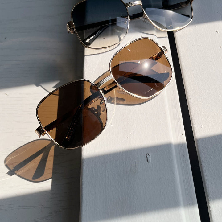 Ladies fashionable angular sunglasses with luxurious golden frame Bowlift