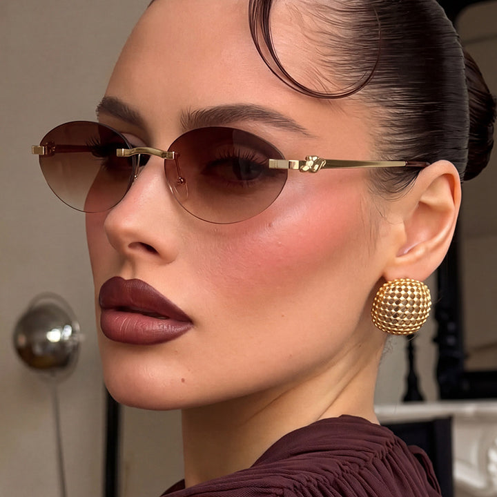 Women's elegant oval sunglasses with golden accents Bowlift