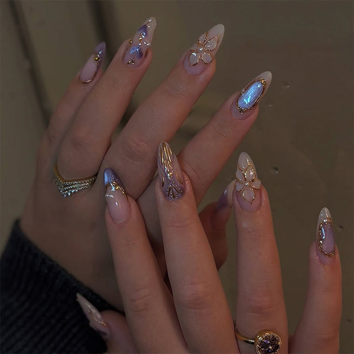 Artificial nail set with glamorous floral designs and creative glitter accents Bowlift