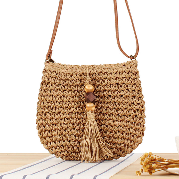 Braided shoulder bag with tassels and wooden decorations Bowlift