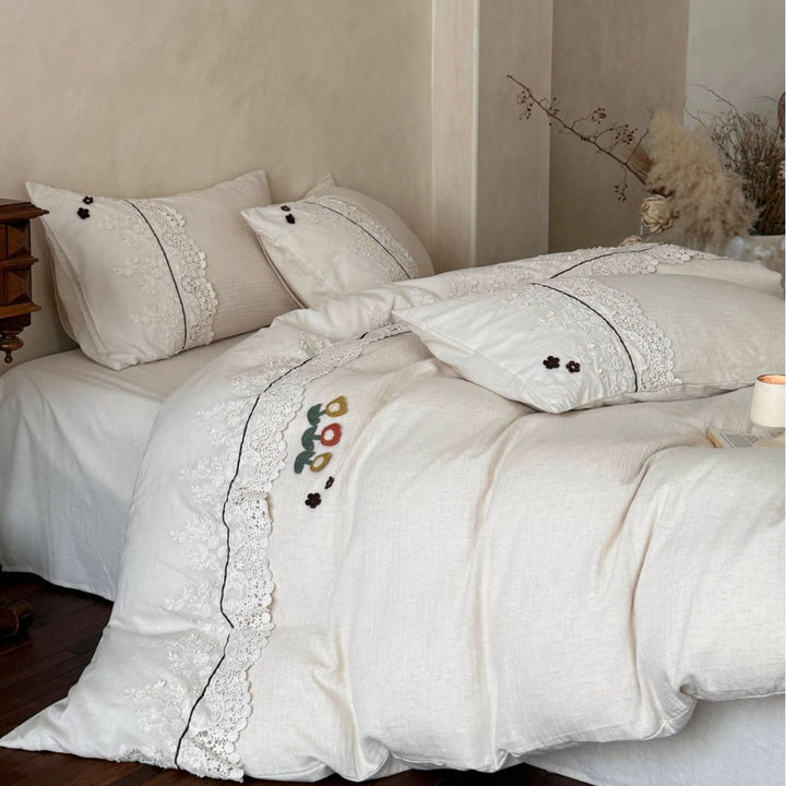 Bedding set in linen look with embroidered lace border and fine embroidery
