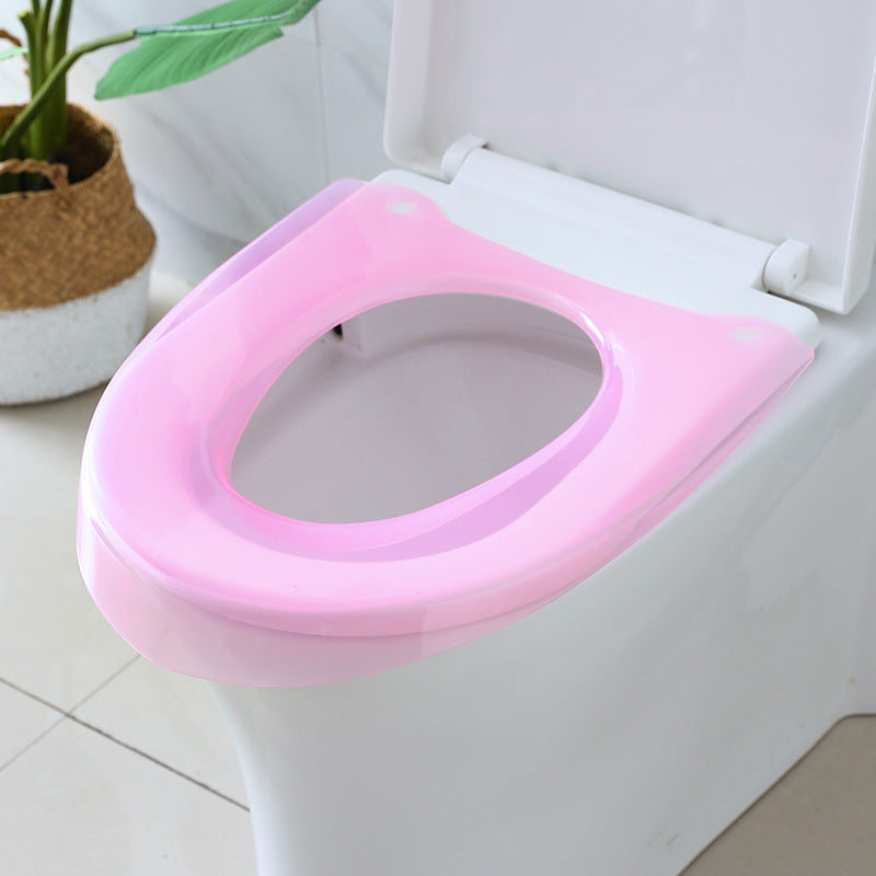 Padded toilet seat reducer with non-slip grips Bowlift
