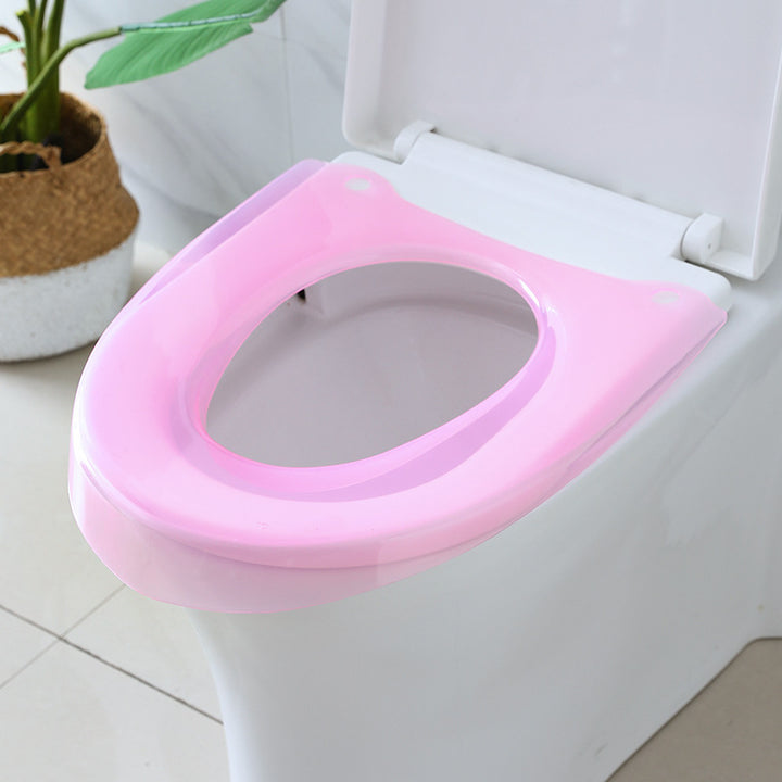 Padded toilet seat reducer with non-slip grips Bowlift