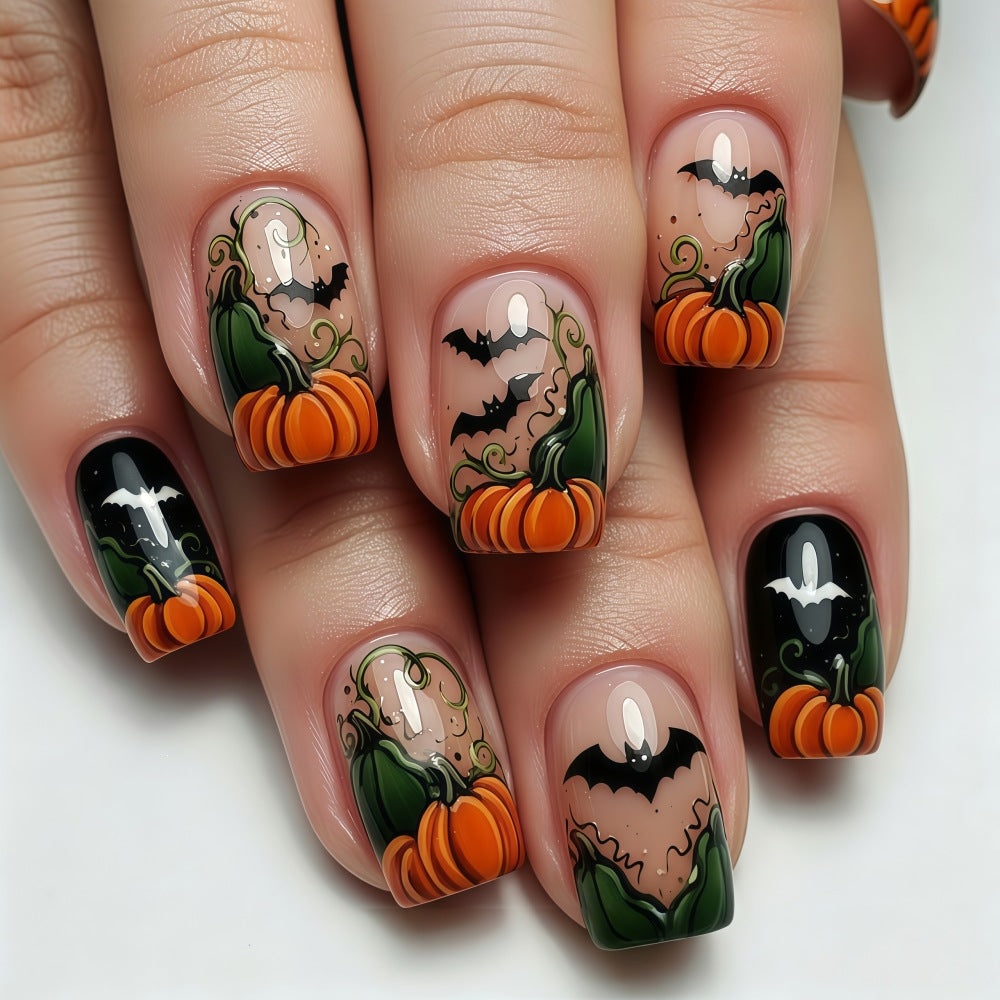 Artificial nails in Halloween design with pumpkins and ghosts Bowlift