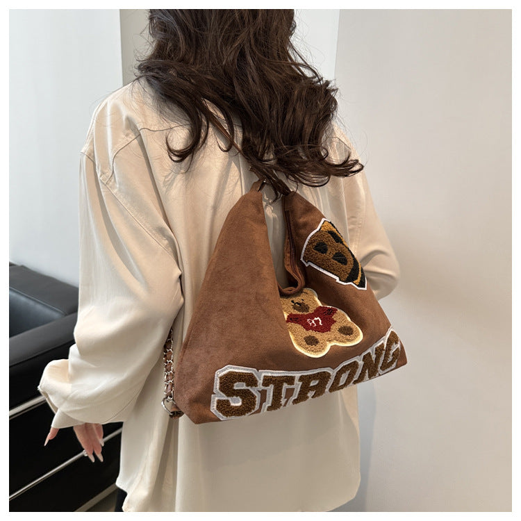 Shoulder bag in playful bear pattern Bowlift