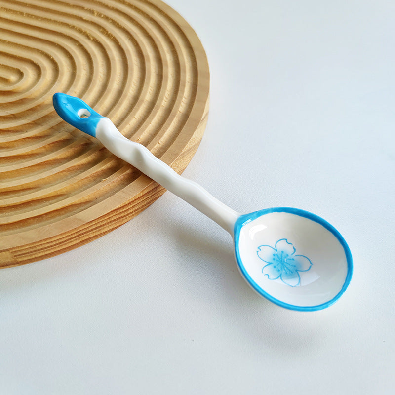 Ceramic soup spoon with lucky cat illustration and ergonomic long-handle Bowlift