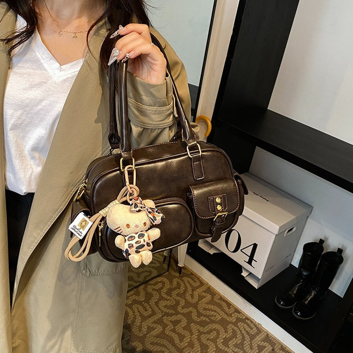 Elegant Handbag with Playful Charms and Multiple Compartments Bowlift