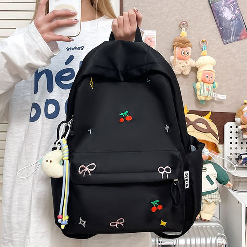 Playful backpack with embroidery Bowlift