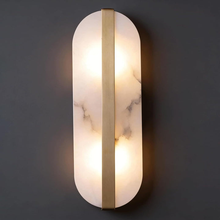 Modern marble oval wall sconce with brass accent and dual pin lamp holders Bowlift