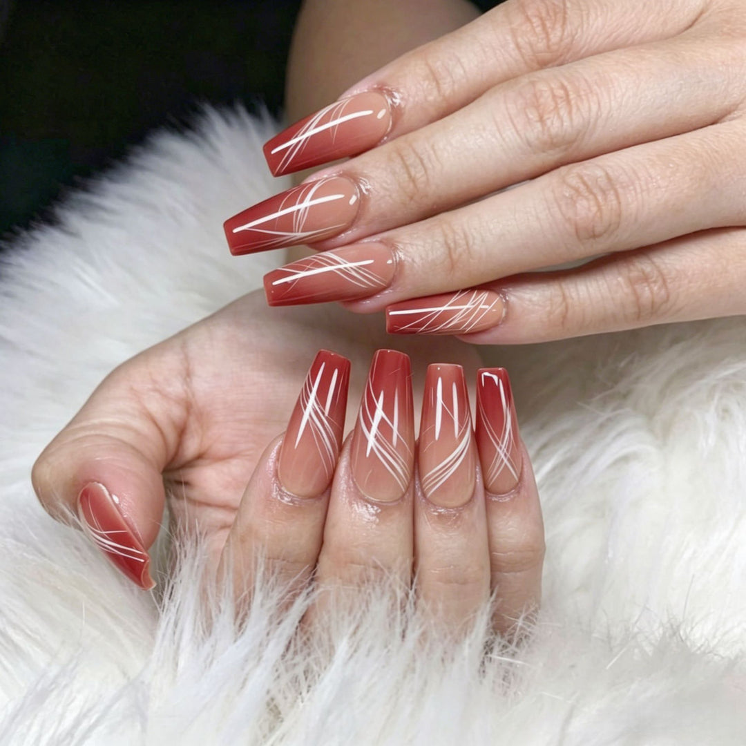 Artificial nails in elegant ombre design with fine lines Bowlift