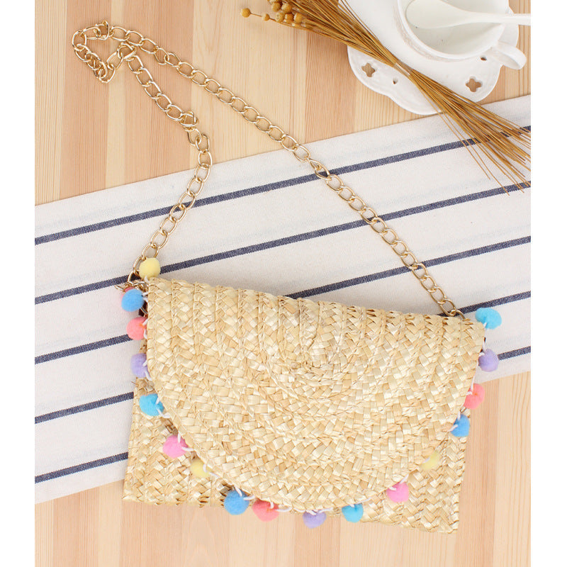 Clutch Bag Made of Handwoven Straw with Decorative Pompons Bowlift