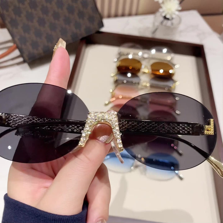 Women's sunglasses with glittering frame and oval lenses Bowlift