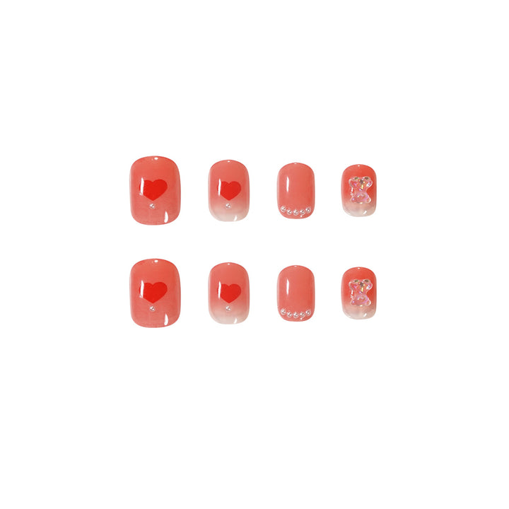 Artful nail art with radiant shine and heart motifs Bowlift