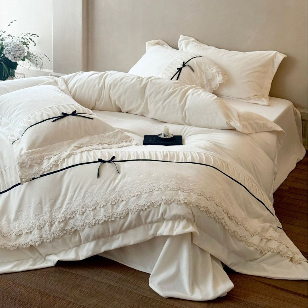 Romantic cotton satin bed linen set with ruffled hem, lace trim and decorative ribbons Bowlift