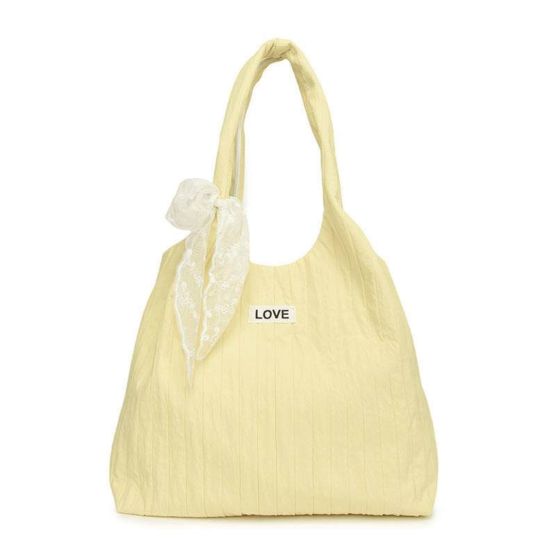 Leisure bag with structured design and playful scarf Bowlift